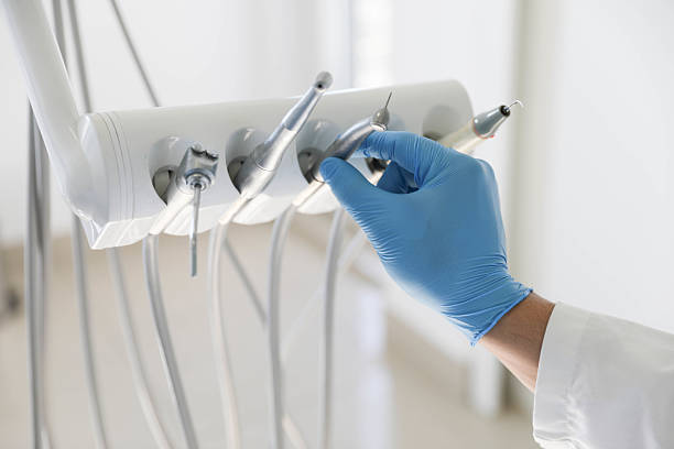 Professional Tooth Extraction technician working in Baldwyn, MS